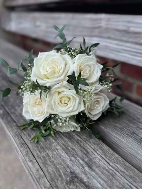 Handheld Prom Bouquet - Small, handheld prom bouquet using a half dozen roses, filler and greenery. Wrapped in ribbon color of your choice, presented in a vase with water. We will do our best to accommodate special requests, based on availability.