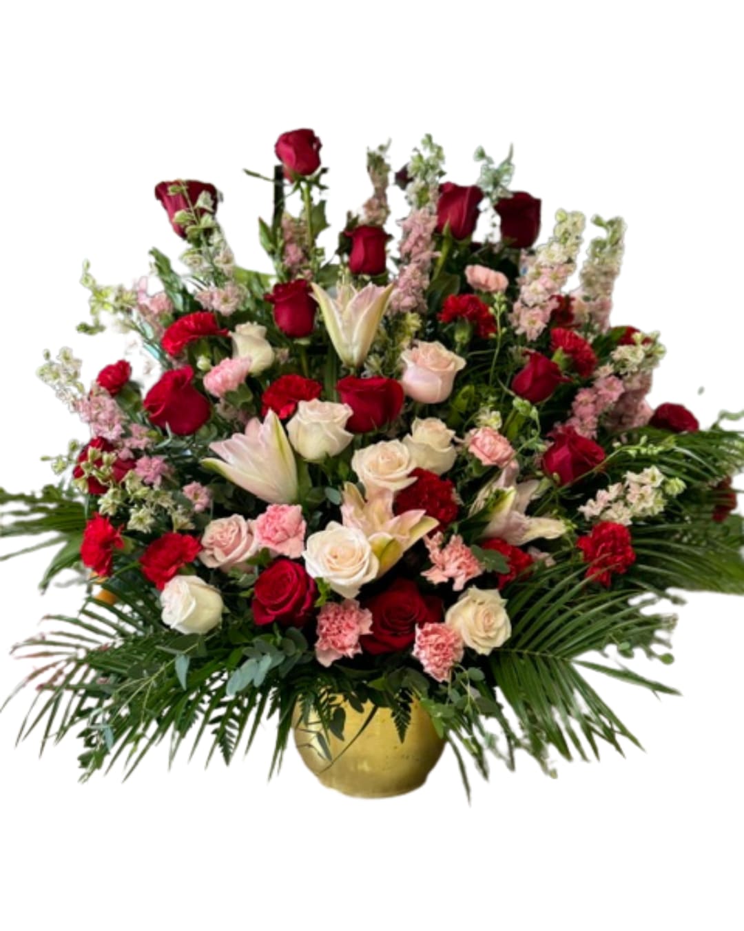 Treasured Love - Red, pink and white flowers create a feminine arrangement that exudes love. An oversized vase arrangement meant to be displayed at the service, easy for the family to bring home if they choose. 