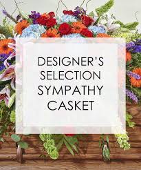 Sympathy casket spray with mixed colorful flowers
