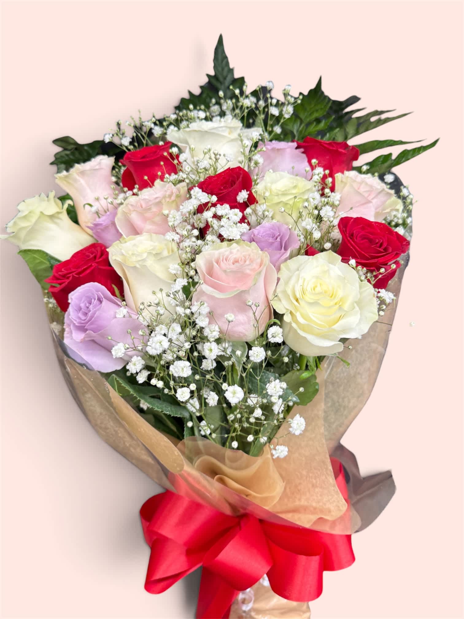 Bouquet of multicolored roses with baby's breath and a red ribbon