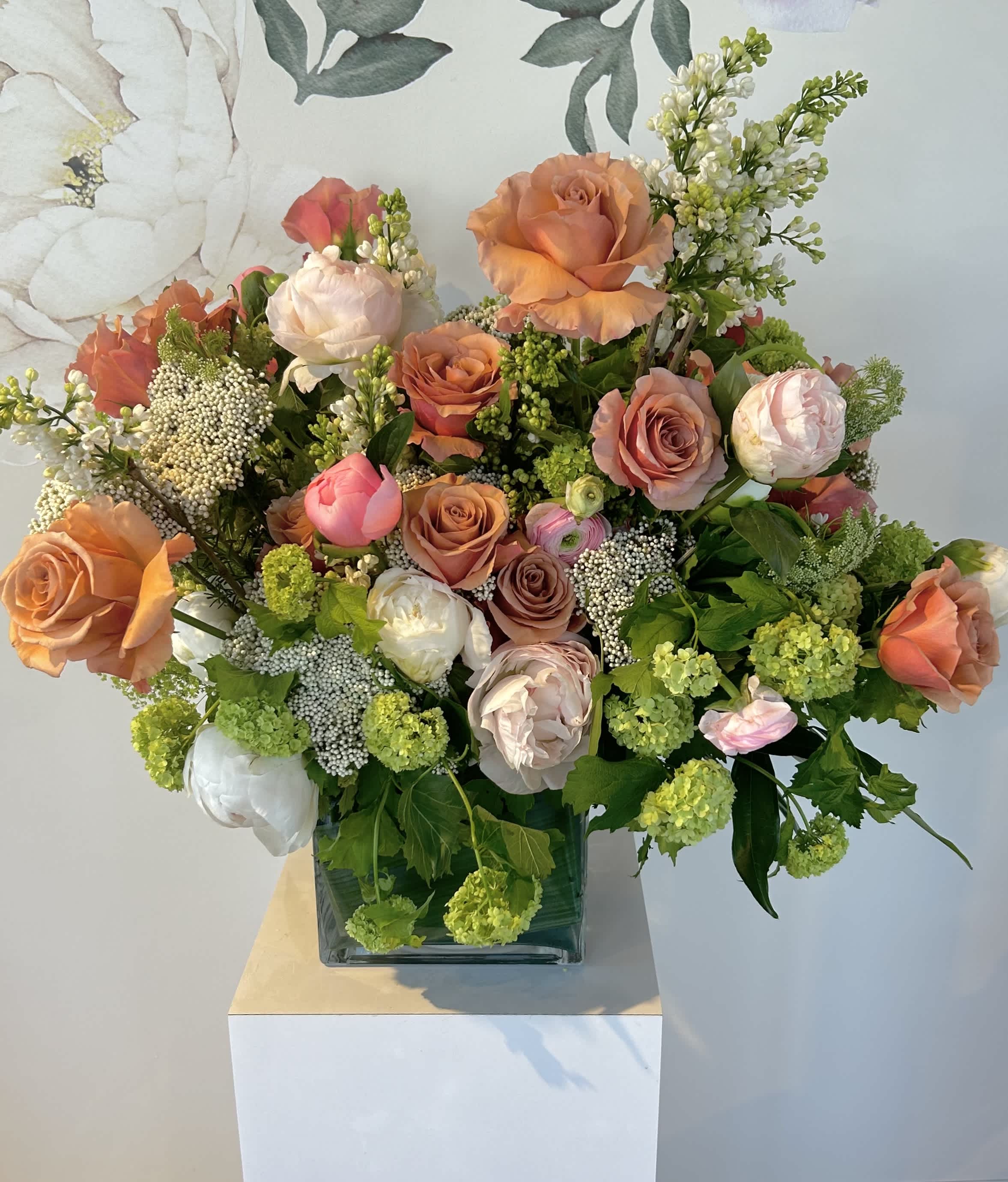 The Grand Goddess - We made this arrangement for a client and fell in love with the color palette so much we wanted to offer to all of our clients.   We will boast first about the premium size as it is packed into a gorgeous  8” X 8” vessel that is wide and grand for any mom, queen or stunning wow piece! (Pictured above)   The standard and deluxe sizes come in a 6x6 vase and the premium size in an 8x8.  Its meant to be grand and gorgeous with sand / peachy color roses, green hydrangea, peony and other seasonals!   NOTE - WHEN PEONY ARE NOT IN SEASON (APPROX AUGUST-APRIL) WE WILL SUB WITH SOMETHING BEAUTIFUL WE KNOW OUR PEONY LOVERS!  WE LOVE RANUNCULUS, DAHLIA, GARDEN ROSES &amp; DUTCH HYDRANGEA.