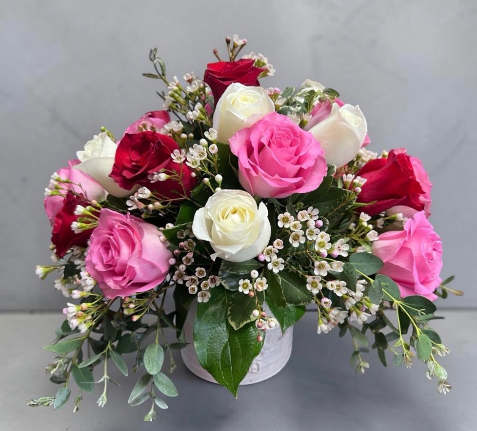 A New Day - Beautiful designed 16 mixed roses in a white ceramic container. 