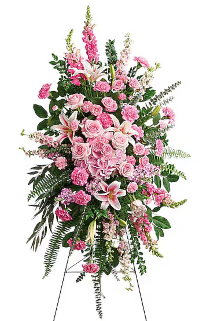 Tall pink floral standing spray with roses and lilies