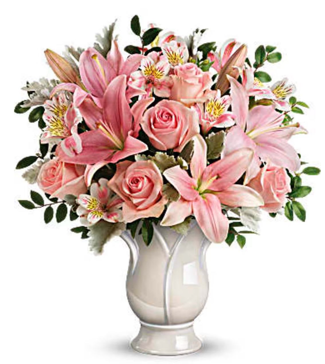 Pink lilies and roses arranged in a white vase