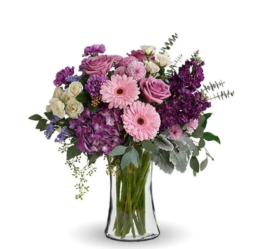 Magnificent Mauves - This harmonic mix of deep purple hydrangea with light lavender roses and sweet pink gerberas is a dreamy delight on any occasion.