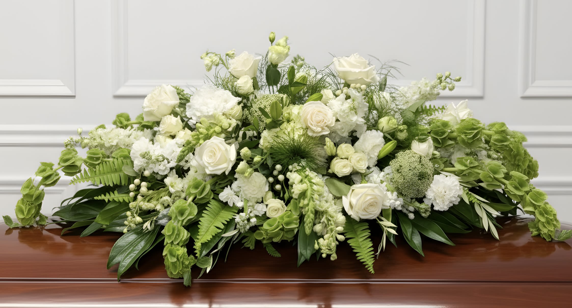 Peaceful Garden Embrace - The Peaceful Garden Embrace is an elegant yet comforting tribute that symbolizes peace, remembrance and the enduring beauty of a life well lived. 