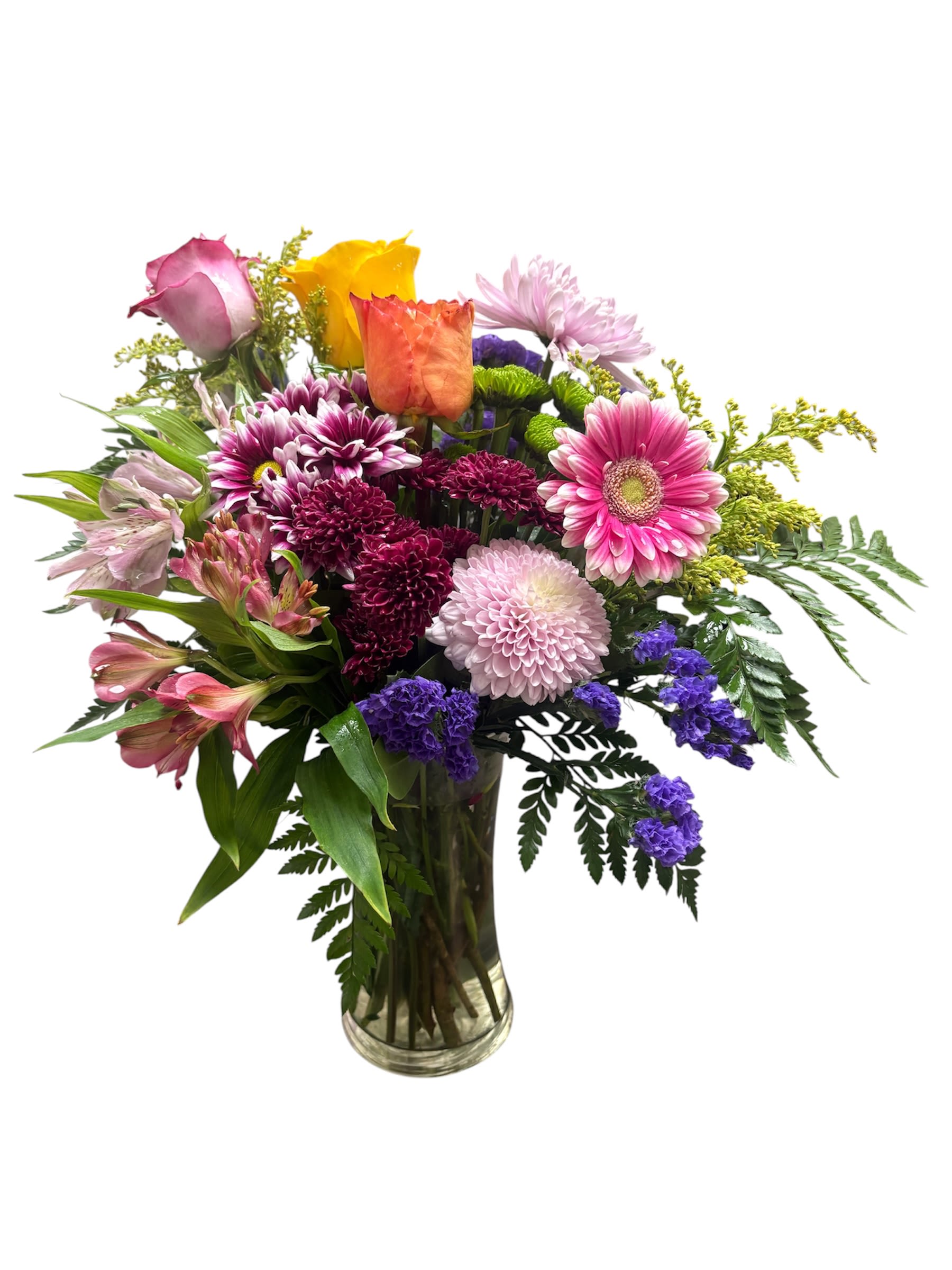 Splendid Beauty  - A lively medley of pink, purple, yellow and orange blooms makes this mixed flower arrangement a cheerful choice for birthdays, thank-you gestures, or springtime celebrations. The bouquet's bright gerbera daisies and roses create an uplifting focal point that will make the person you're thinking of feel noticed and celebrated from the moment it arrives.  Layered beneath those focal blooms are rounded chrysanthemums, alstromeria and smaller accent flowers that add texture and a soft blush counterpoint to the vivid hues. Arranged with a slightly asymmetrical, abundant shape in a clear glass vase, the design reads fresh and classic-easy to tuck onto a table or desk while still making a confident visual statement.  Perfect for sending to a friend, coworker, or family member who could use a colorful pick-me-up, this arrangement sends a message of warmth and appreciation. Delivered ready to display in the included clear glass vase; typical care is simple-fresh water and a fresh cut to the stems will help keep the bouquet bright for days.