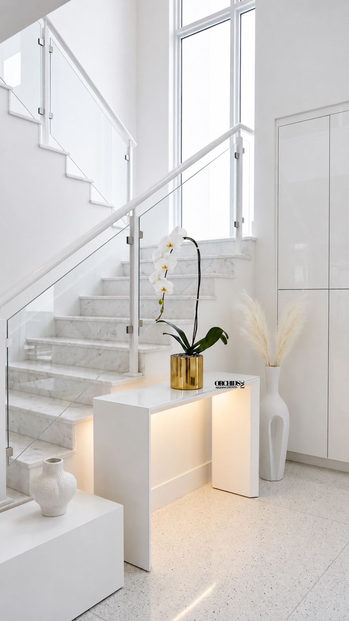 White Phalaenopsis Orchid Arrangement – Single Stem Minimal Luxury - Single Luxury White Phalaenopsis orchid Arrangement designed for gifting with a Gold Vase 6” x 6”. We offer flower delivery, same day flower delivery, orchid delivery, and same day orchid delivery in Miami Dade Broward and Palm Beach.