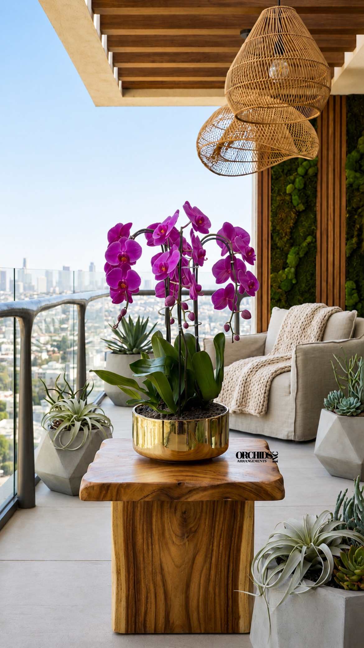 Purple orchids in a gold pot on a wooden table