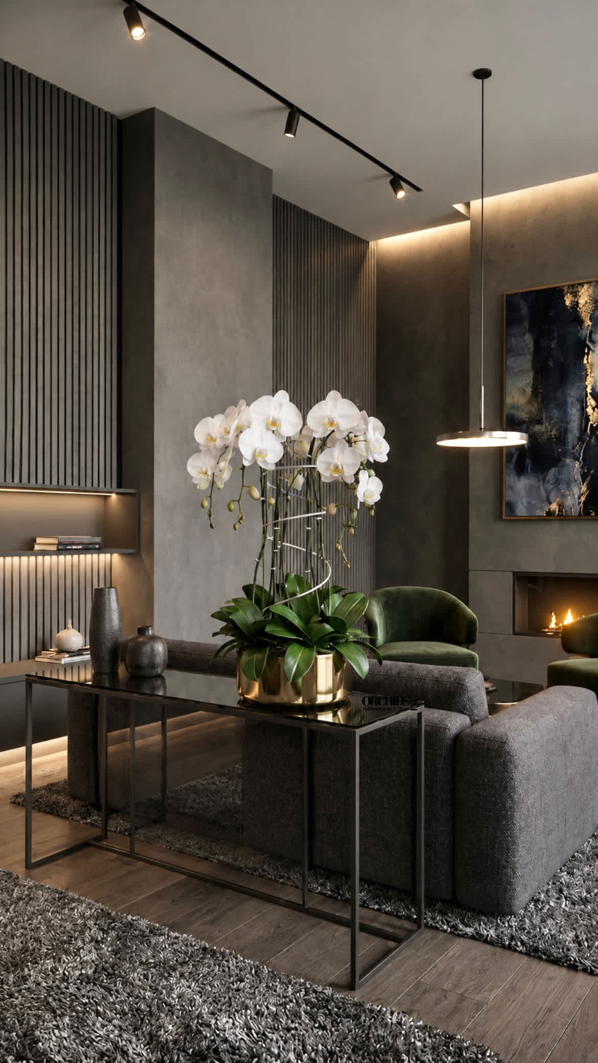 White orchids arranged in a gold pot on a table in a modern living room