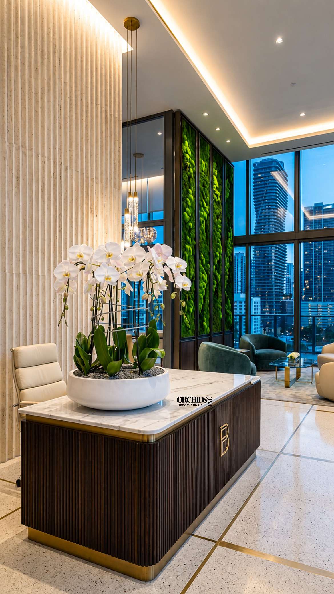 White orchids arranged in a shallow white planter on a lobby table