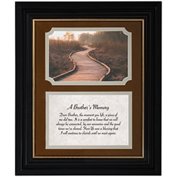 "Brother's Memory" Framed Prayer - "A Brother's Memory" framed prayer offers a gentle, reflective tribute for sympathy and funeral moments, created to comfort someone grieving the loss of a brother. The framed wall plaque places a heartfelt prayer in elegant script against a warm, parchment-like background so the words read clearly and draw the eye; a companion version features a serene, warm-toned photograph of a winding boardwalk leading toward soft, distant light, reinforcing a sense of peaceful remembrance.  Crafted with a black frame and layered brown and beige mats, the piece reads as both traditional and comforting when displayed alone or alongside floral arrangements. Made with durable polyresin and glass, it includes a velvet easel back and triangle hanger for easy tabletop display or wall mounting; the frame measures 10" wide by 12" high. For a more personal keepsake, the artwork can be swapped for a 4" x 6" photograph so the person you're honoring feels truly seen and remembered.