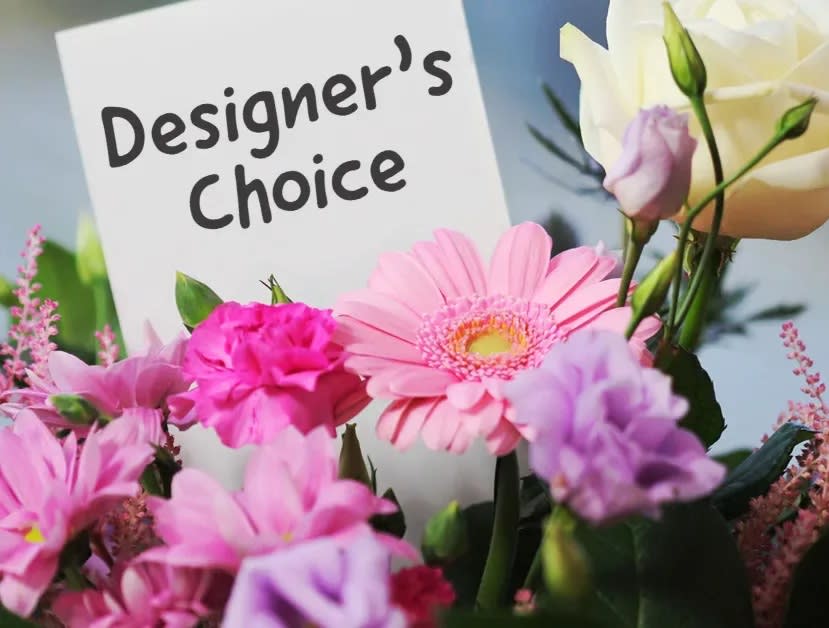 Pink and lavender mixed bouquet with a designer's choice sign