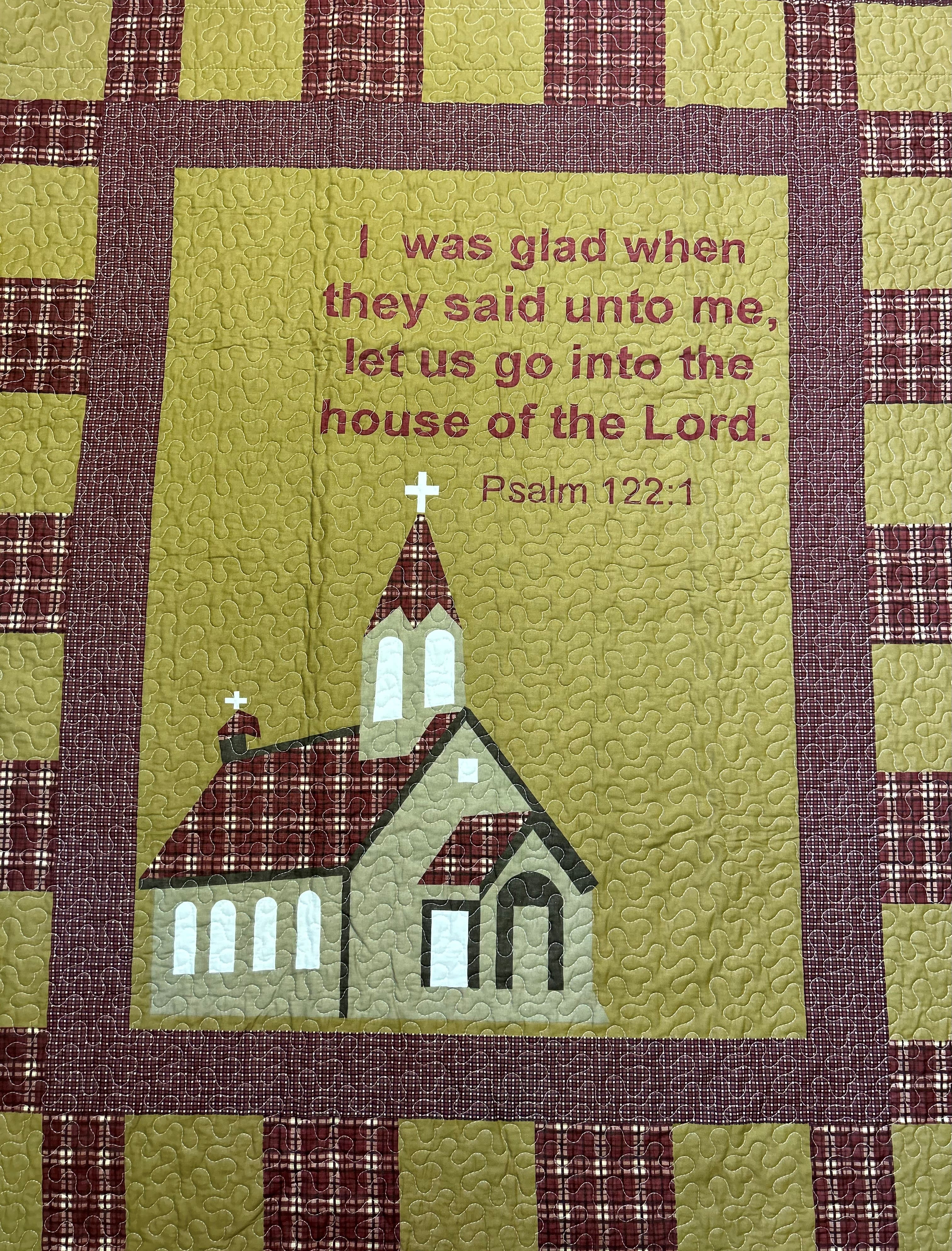 Quilted wall hanging with a church and Psalm 122:1 text