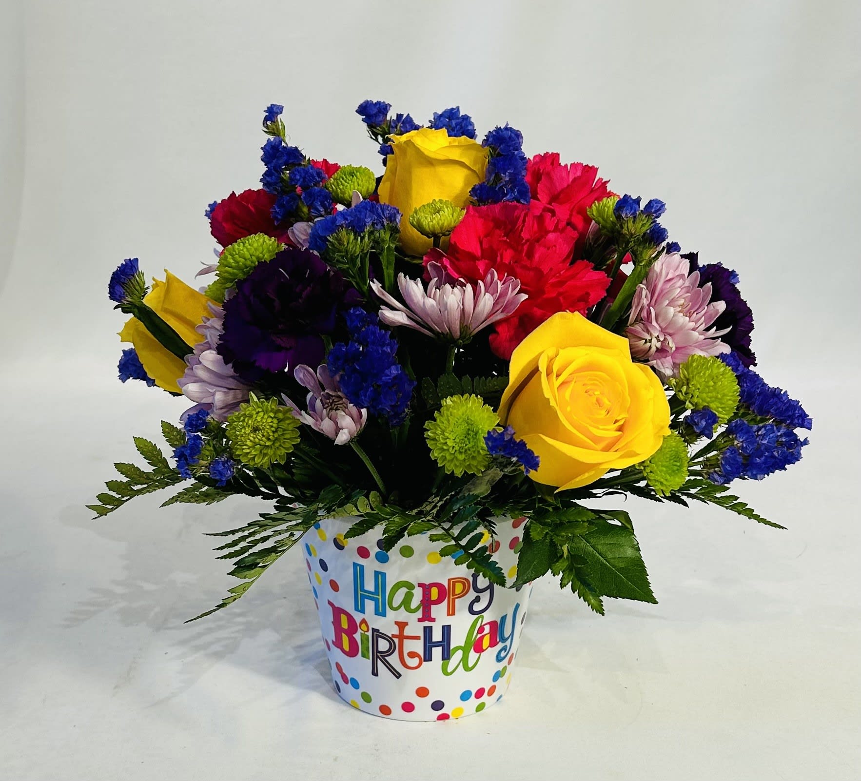 Colorful mixed flower bouquet in a birthday pot