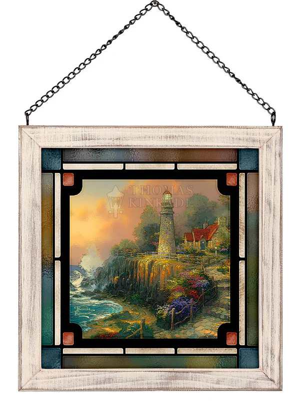 Framed stained-glass-style wall art with a lighthouse scene
