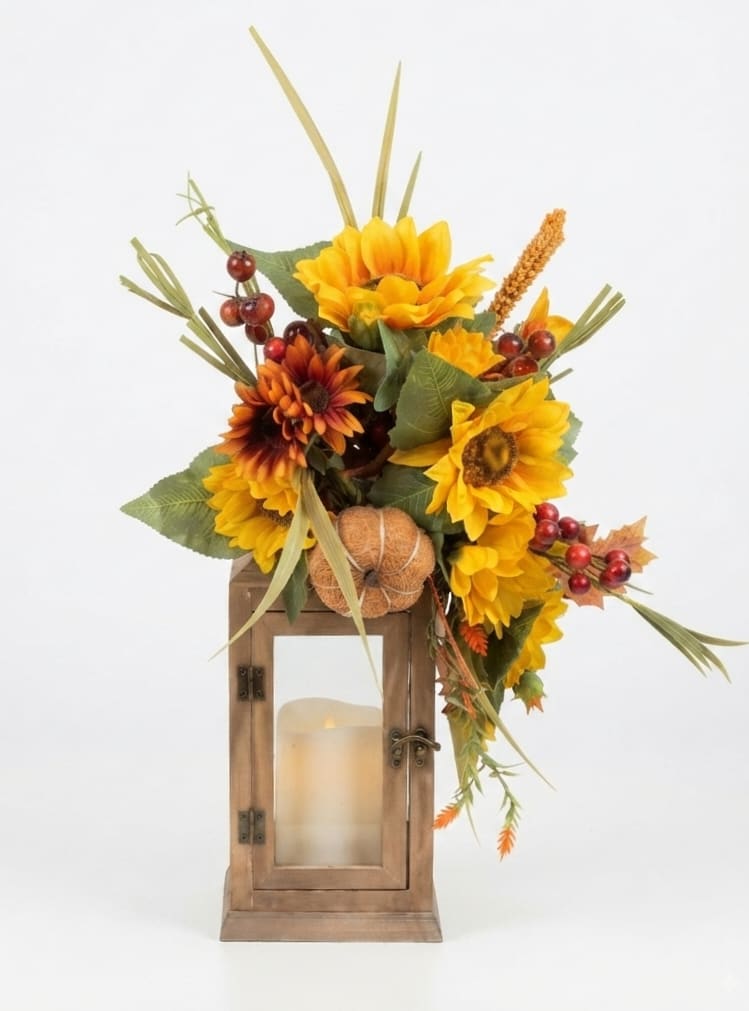 Sunflower arrangement in a wooden lantern with a candle inside