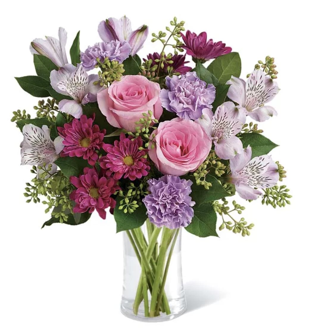 In Bloom - Elicit bubbly, delighted laughter by sending this effervescent bouquet! The pinks and purples play perfectly together, and are sure to make any spring day a little brighter!