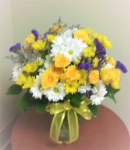 A Gathering of Daisies and miniature Roses - Surprise someone with daisies galore, miniature roses and purple statice for the true daisy lover!