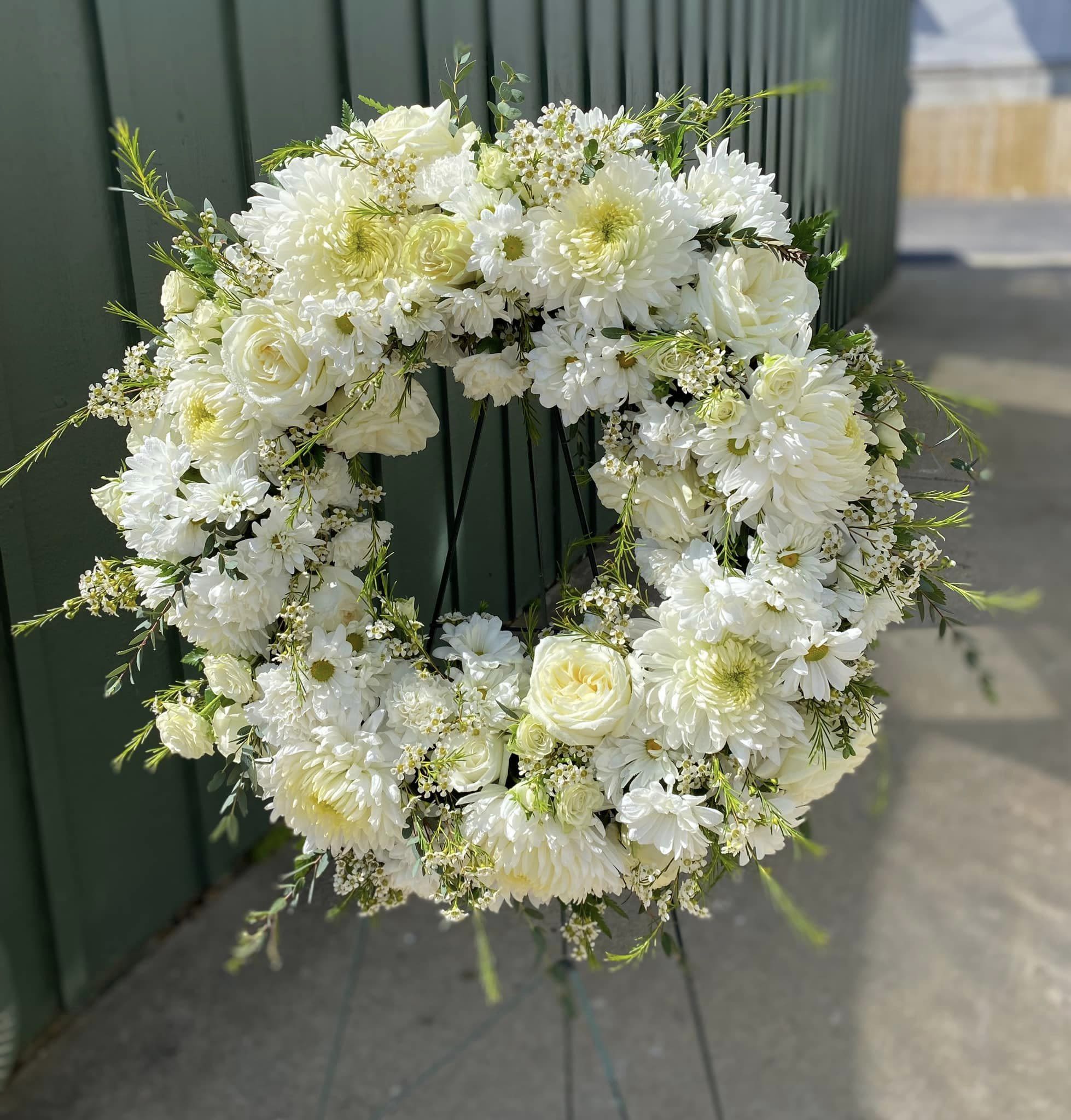 Call to order - Sympathy Easel - Wreath Shape - Our Wreath Shape Easle is fully customizable in colors and flowers. Wreath Shape Easles begin at $200. Wreath Shape Easles can include more flowers and include higher end flowers as the price increases.   Please call to discuss customizations.