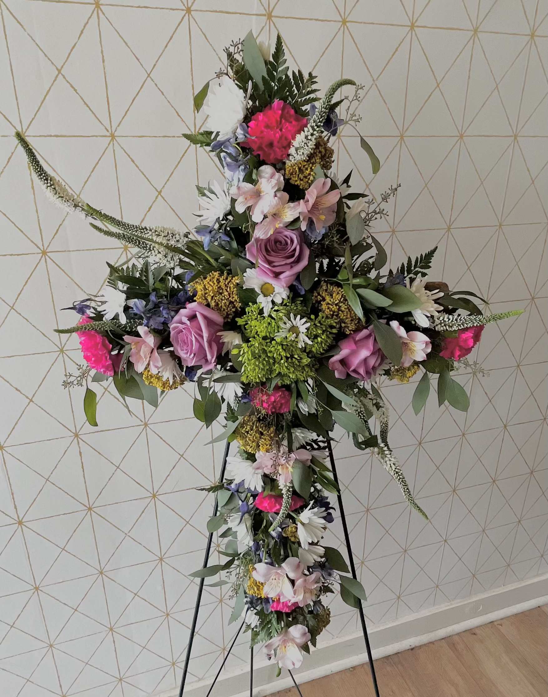 Call to order - Sympathy Easel - Cross Shape - Our Cross Shape Easel is fully customizable in colors and flowers. Cross Shape Easels can include more flowers and include higher end flowers as the price increases.   Please call to discuss customizations. 