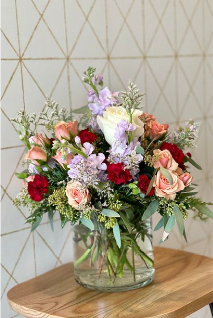 Gardener - A lush mix of blooms and fresh greenery, artfully arranged to capture the chram of a garden in bloom. Perfect for adding natural beauty to any space! 
