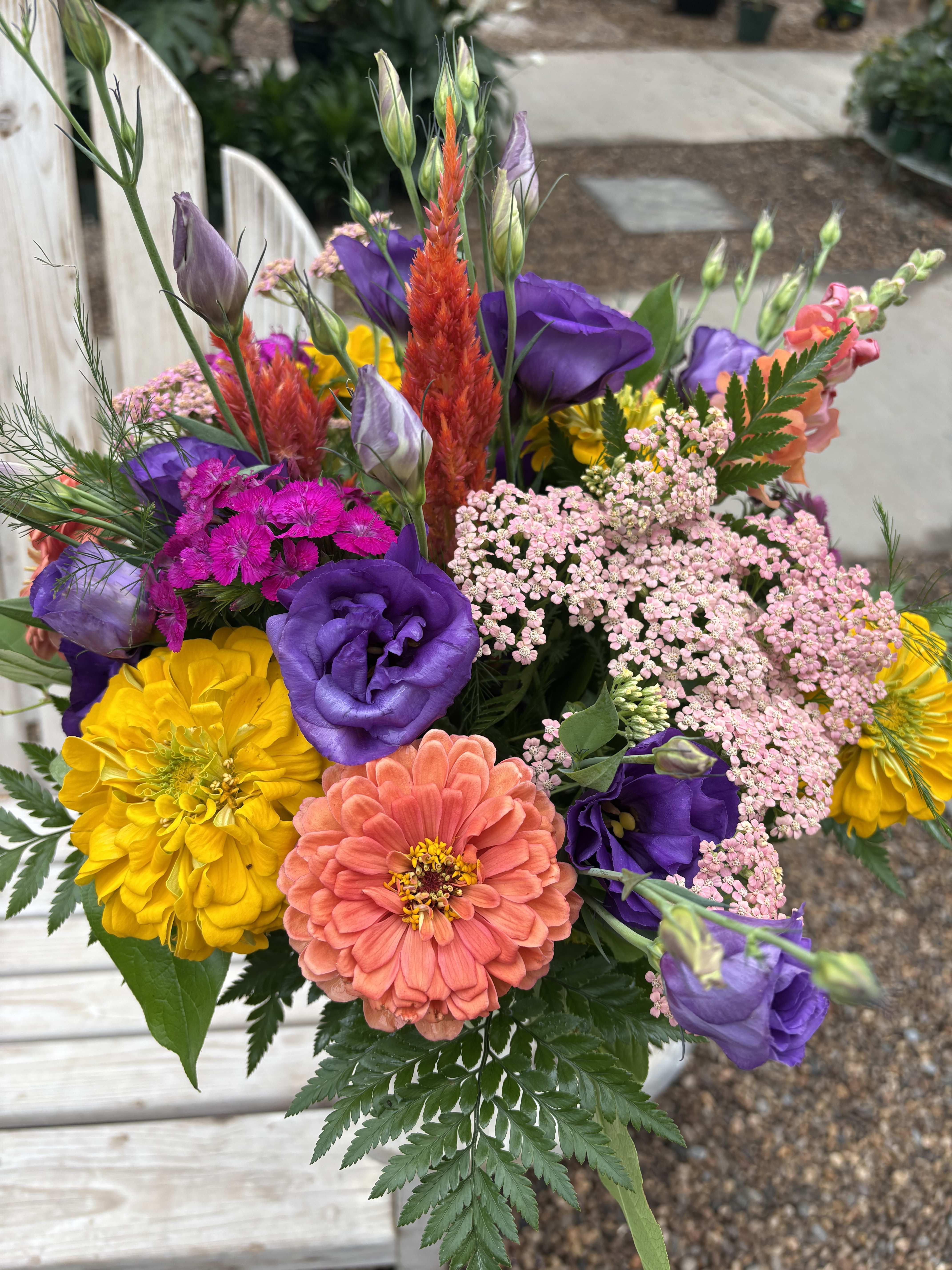 Colorful bouquet with purple, yellow, and coral flowers