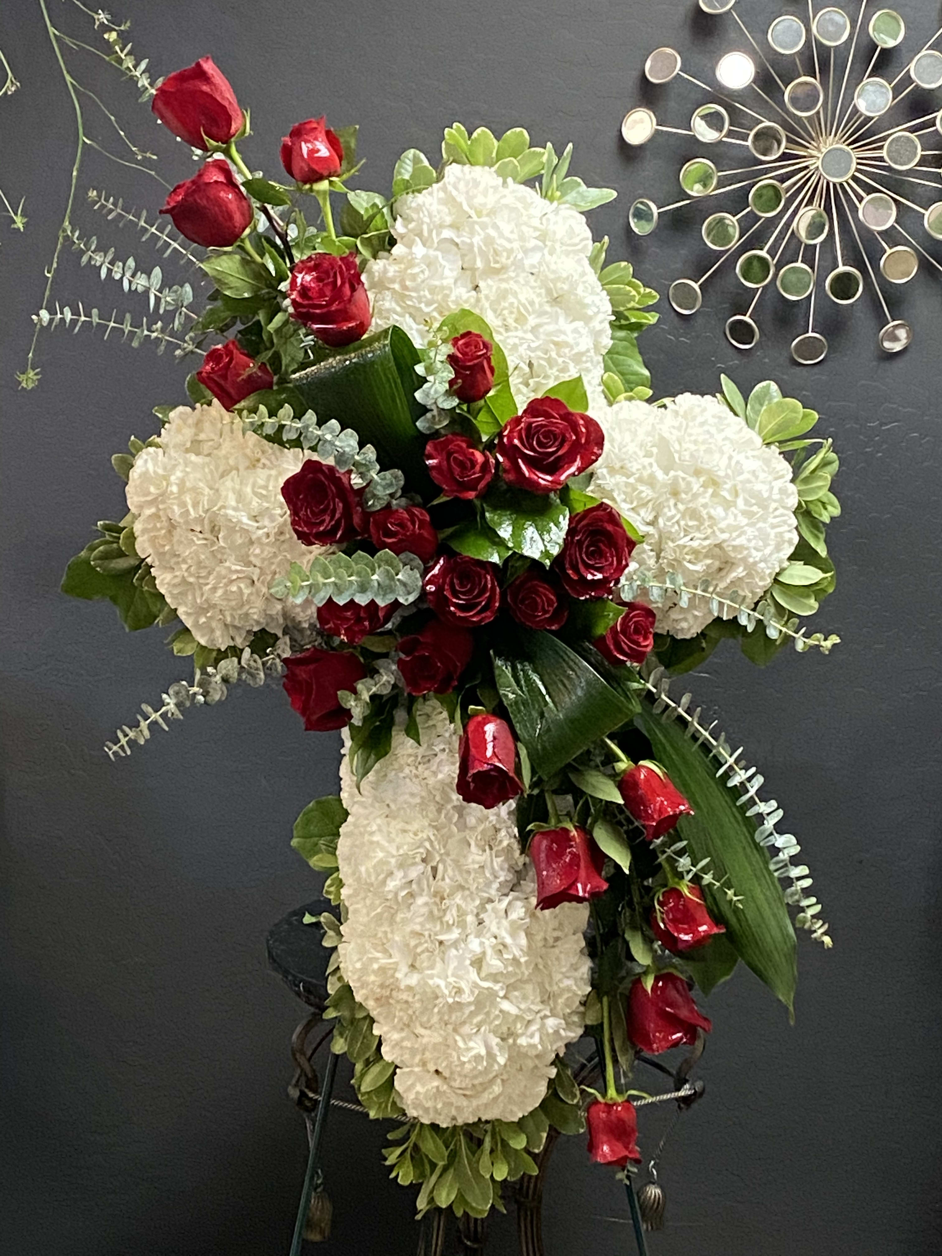 Standing floral spray with red roses and white hydrangeas