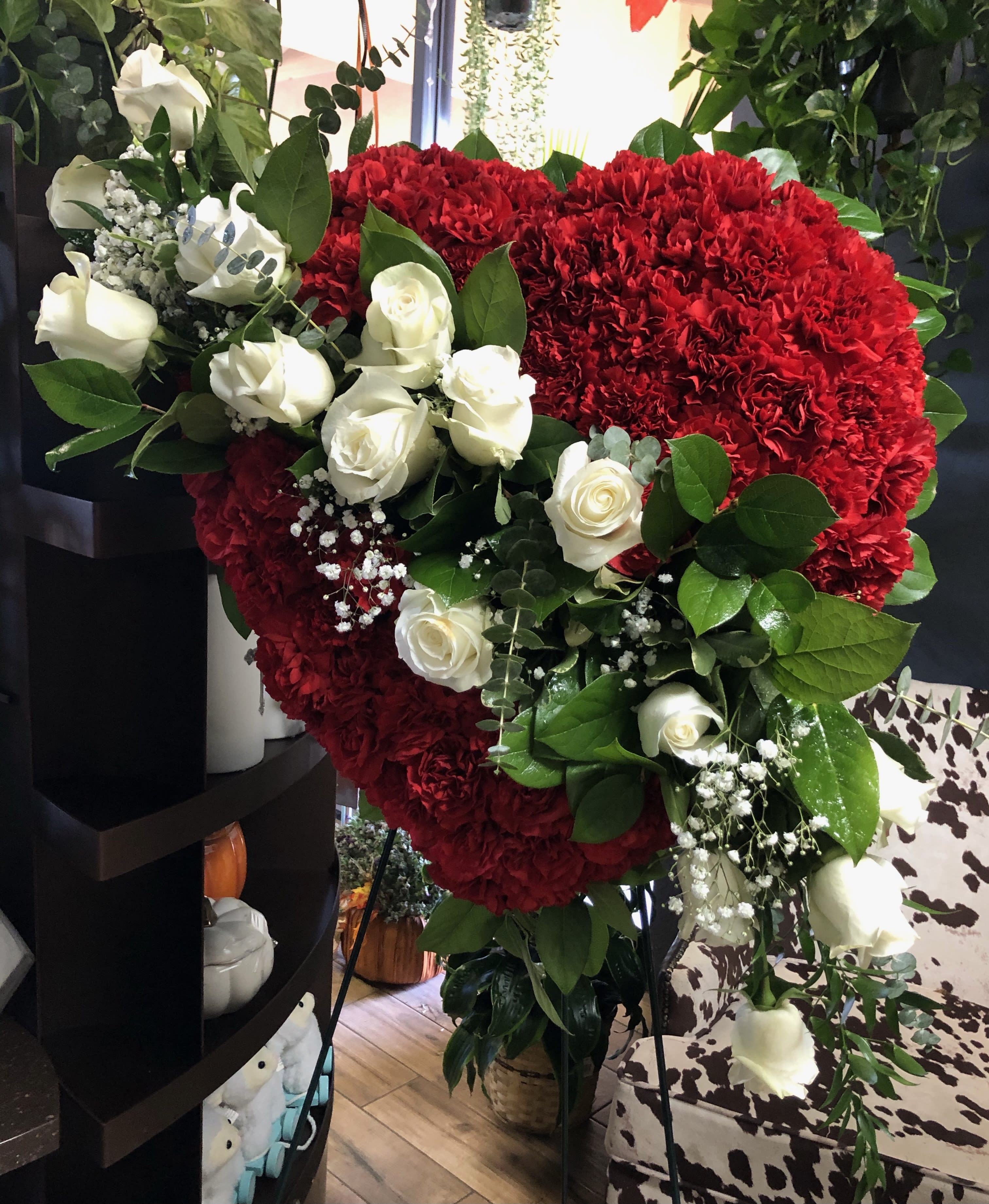 Heart-shaped red carnation arrangement with white roses