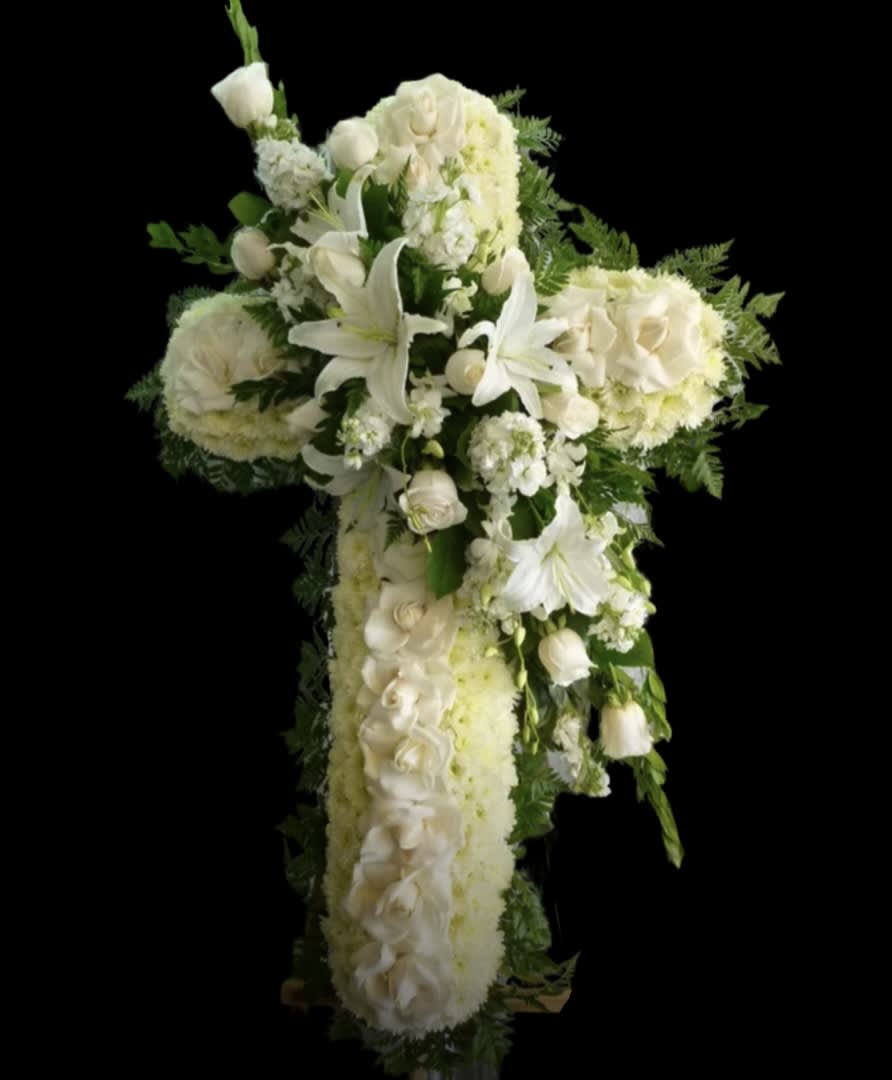 White floral cross arrangement with lilies and roses