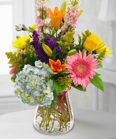 Colorful mixed bouquet in a clear glass vase