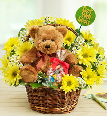 Lotsa Love Get Well - Product ID: 95451  EXCLUSIVE A 3-in-1 smile prescription that's just what the doctor ordered. Send your best wishes for a speedy recovery with our signature Lotsa LoveÂ® combination. A bright and beautiful basket arrangement, a huggable plush bear and a bag of sweet treats will have them feeling positive in no time. We've even added a fun felt "Get Well Soon" pick to help deliver your heartfelt message. Vibrant arrangement of yellow poms, monte casino, salal and variegated pittosporum Expertly designed by our florists in a handled willow basket and accented with a felt "Get Well Soon" pick; basket measures 8"H Our cuddly Lotsa LoveÂ® plush brown bear with brown satin bow; plush measures 10"H and is safe for ages 3 and up Also includes a bag of delicious candy; assortment may vary Arrangement measures approximately 12"H x 12"L Our florists select the freshest flowers available so colors and varieties may vary