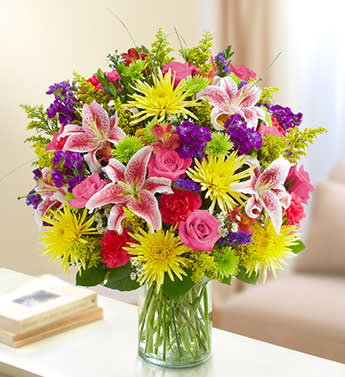Sincerest Sorrow Bright Arrangement - Product ID: 95439   Choosing a sympathy arrangement that is both tasteful and shows the depth of your feelings at this sad time is so important. Our expert florists take these bright and beautiful roses, lilies, spider mums and more, and create an elegant tribute, so you can convey your deepest condolences to friends and family members. Hand-designed arrangement of multicolor roses, lilies, spider mums, alstroemeria, stock, carnations, statice, yarrow, poms, solidago and monte casino Accented with salal, myrtle and bear grass Beautifully crafted by our expert florists in a classic glass cylinder vase; measures 8"H Can be sent to the funeral service or to the home of friends, family members or business associates Large arrangement measures approximately 24"H x 22"L Medium arrangement measures approximately 22"H x 20"L Small arrangement measures approximately 20"H x 18"L Our florists hand-design each arrangement, so colors, varieties and container may vary due to local availability