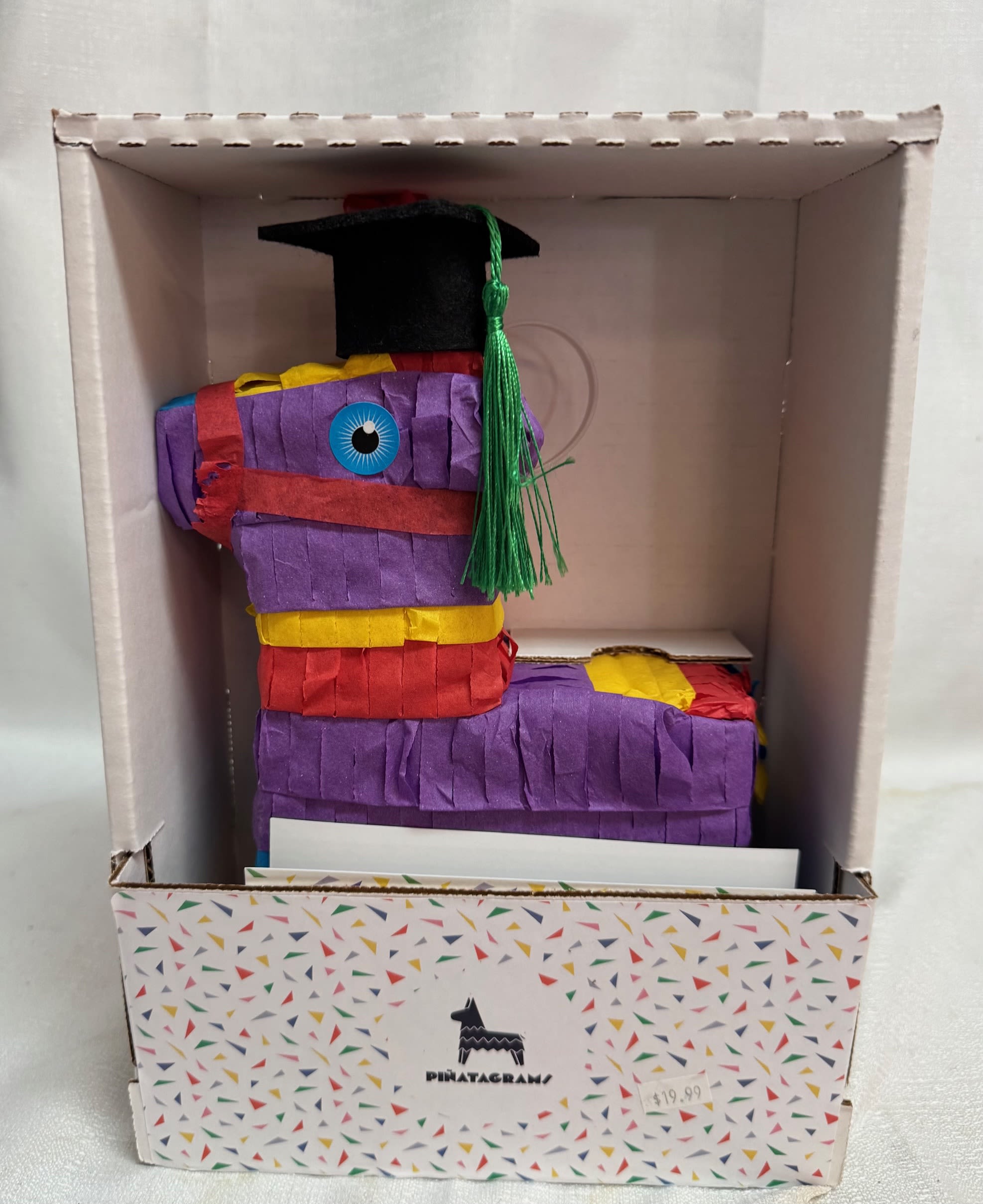 Graduation Piñata - This cute piñata stands about 12" tall. It comes pre-filled with some hard candy. 