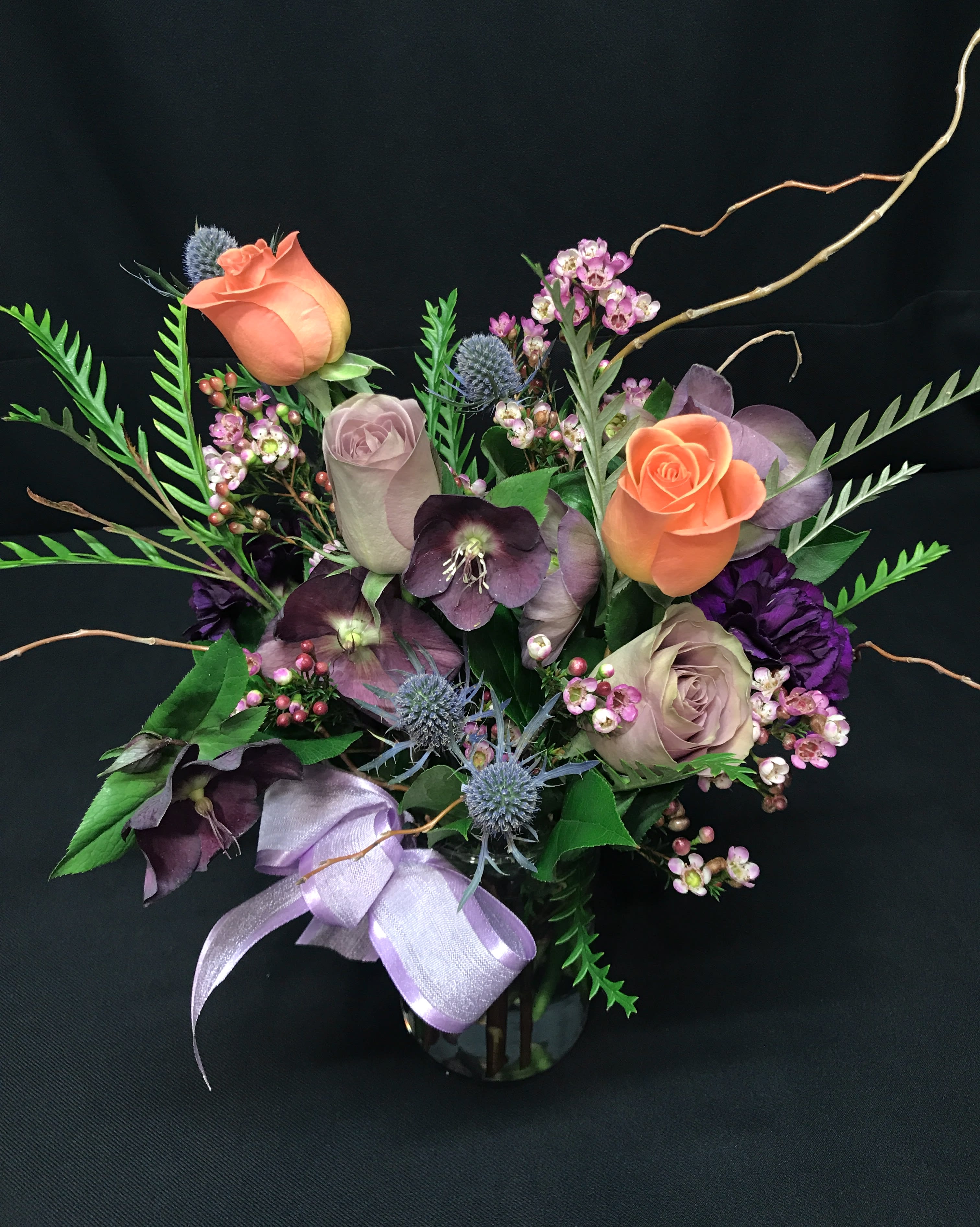Small premium rose bud vase with willow - Small but lovely vase of premium roses and season's best flowers in a vase with willow branches. Assortment and Color will vary.