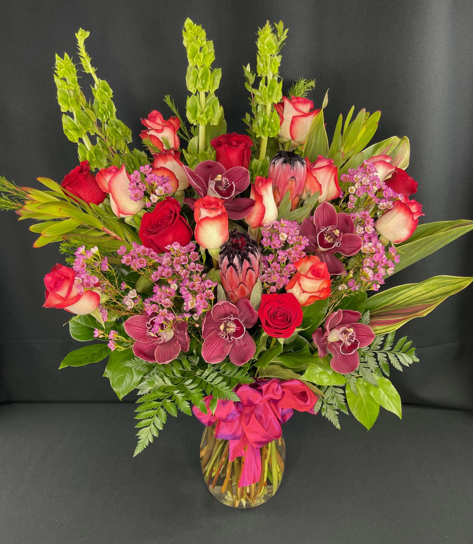 Large Full Orchid Rose Bouquet - LOTS of Gorgeous Roses Large Cymbidium Orchids and plenty of interesting premium, foliage and accent flowers to compliment.  Colors and flowers may vary, especially when not ordered a week in advance / 3 weeks prior to Valentine's or Mother's day.  Beautiful in so many color combinations!