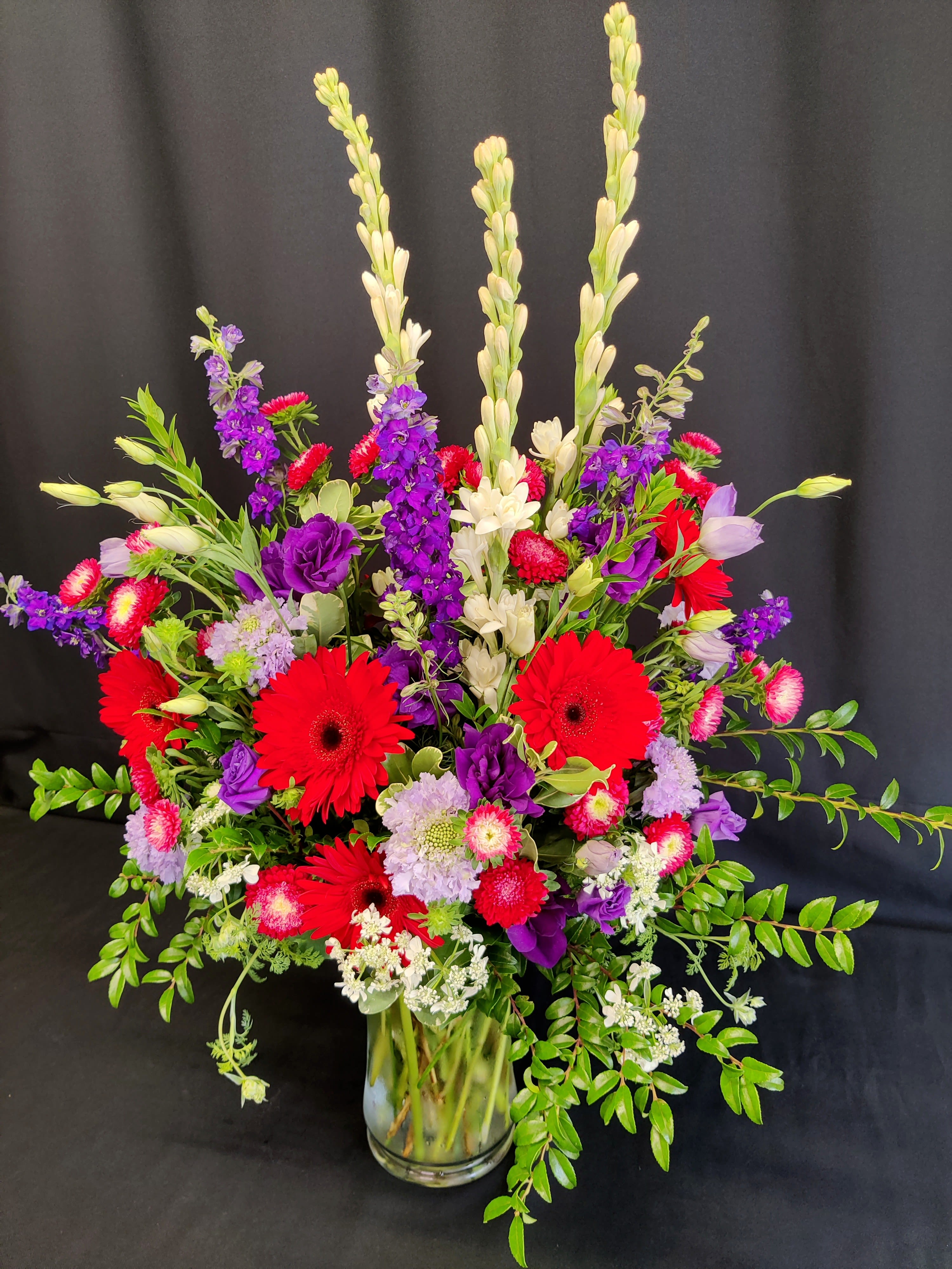 Sympathy vase for the service - Large tall vase of flowers for a Celebration of life or memorial service. You may select specific colors when you order at least 5 days ahead. For more specific requests, please phone in your order. This is one of our biggest vases and will be a splendid display.