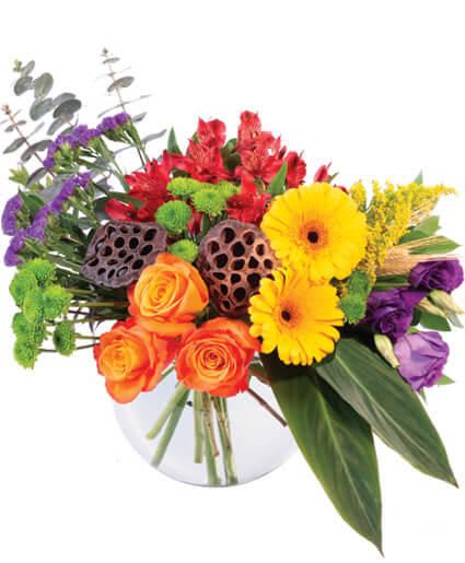 COLORFUL ESSENCE FLORAL ARRANGEMENT  - Colorful Essence has all the beauty of a garden bouquet eloquently design and placed in a bubble bowl. From orange roses and yellow gerberas to purple lisianthus and red alstroemeria, this floral arrangement is a great way to let your loved ones know you're thinking of them! 