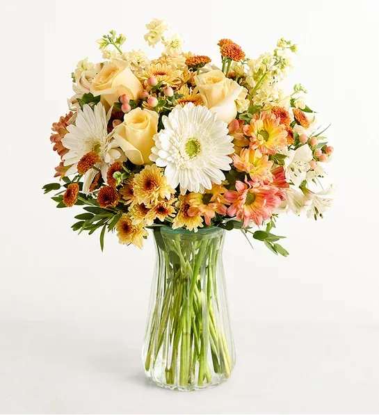 Fall Into Autumn Bouquet  - NEW Autumn isn’t all bold orange and fiery red. It’s also serene cream, soft yellow, gentle peach, and warm bronze—just like this extraordinary bouquet. A happy marriage of the classic and the contemporary, it’s certain to delight family, friends, or that special someone.