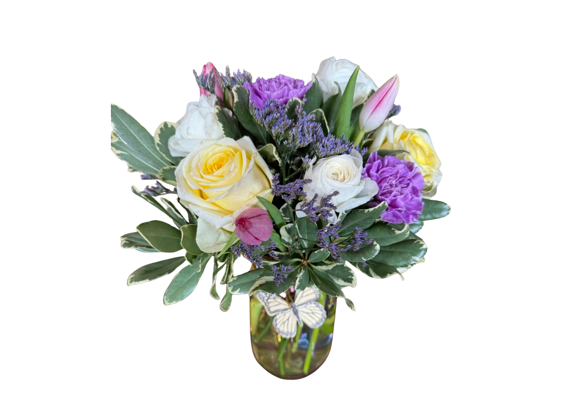 Bouquet of yellow and white roses in a glass vase