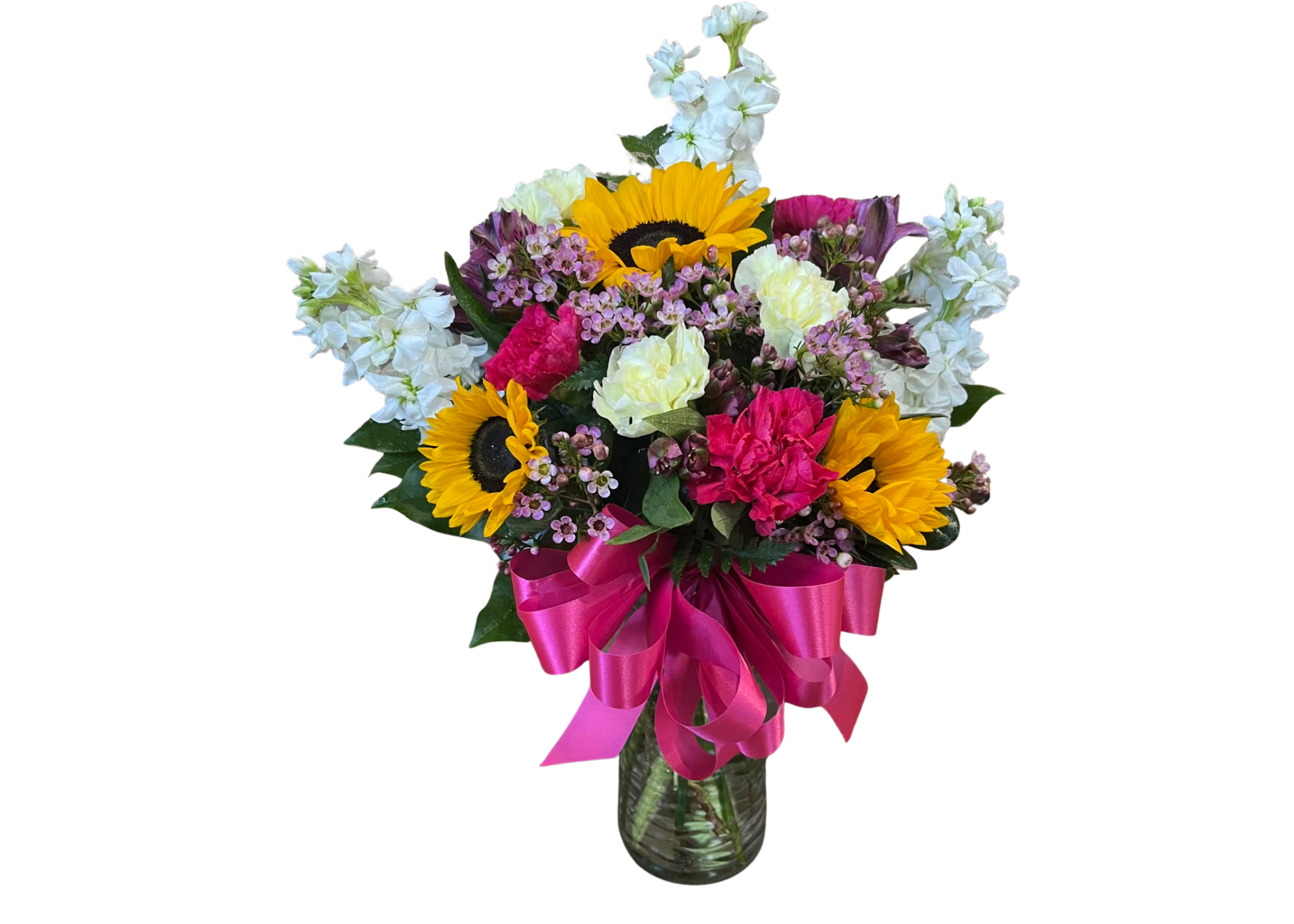 Bright mixed bouquet with sunflowers and pink and white flowers in a glass vase with a hot pink bow