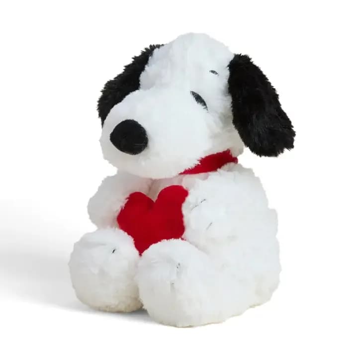Plush Snoopy holding a red heart
