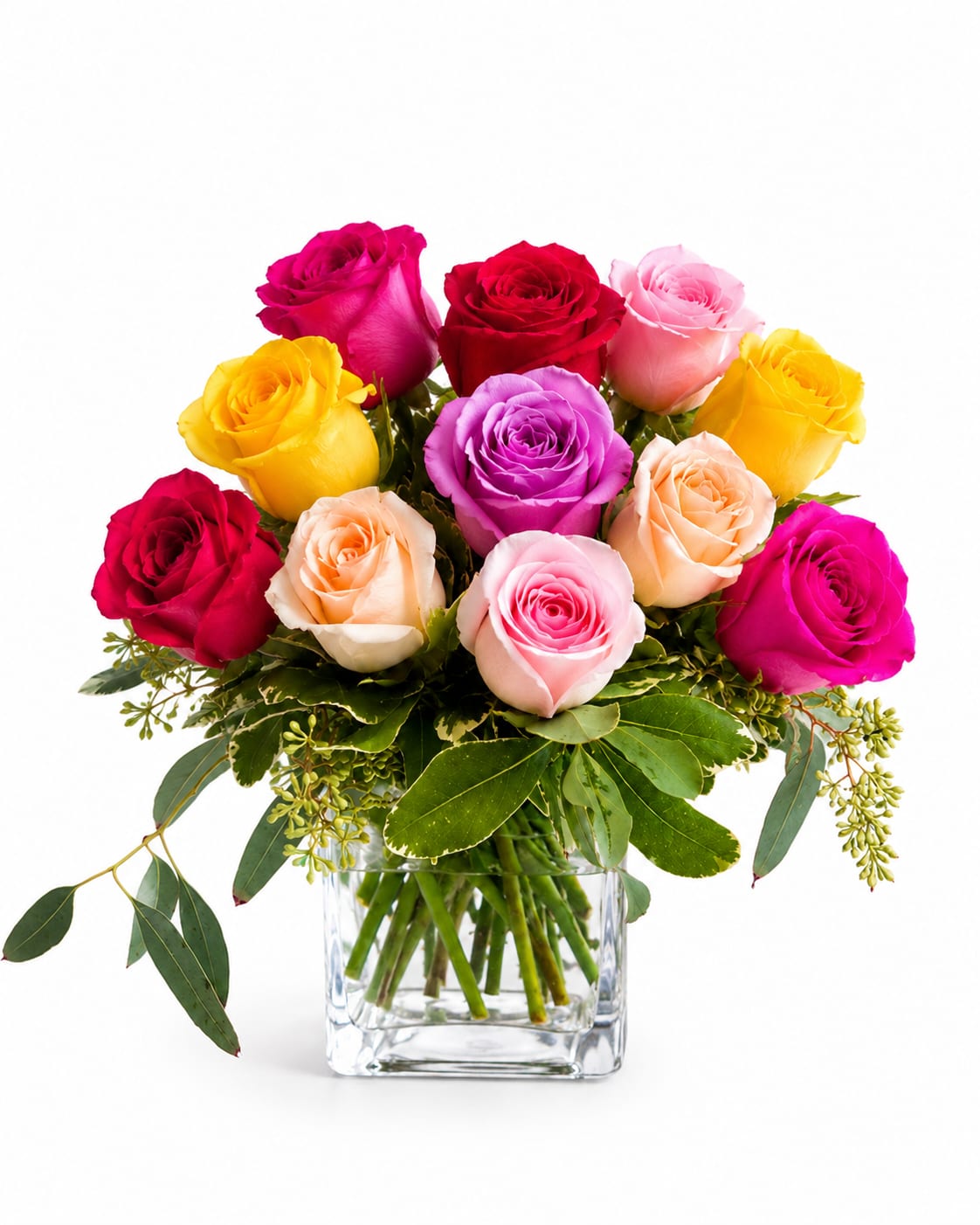 Dozen Roses - This arrangement will look approximately as shown in the photo. It will feature a full 360° design with one dozen mixed roses arranged all the way around in a very similar clear glass vase. Rose colors will vary and may include shades of pink, peach, white, purple, coral, hot pink, and other coordinating tones based on availability. Each arrangement is handcrafted and unique while keeping the same overall style and feel as pictured.