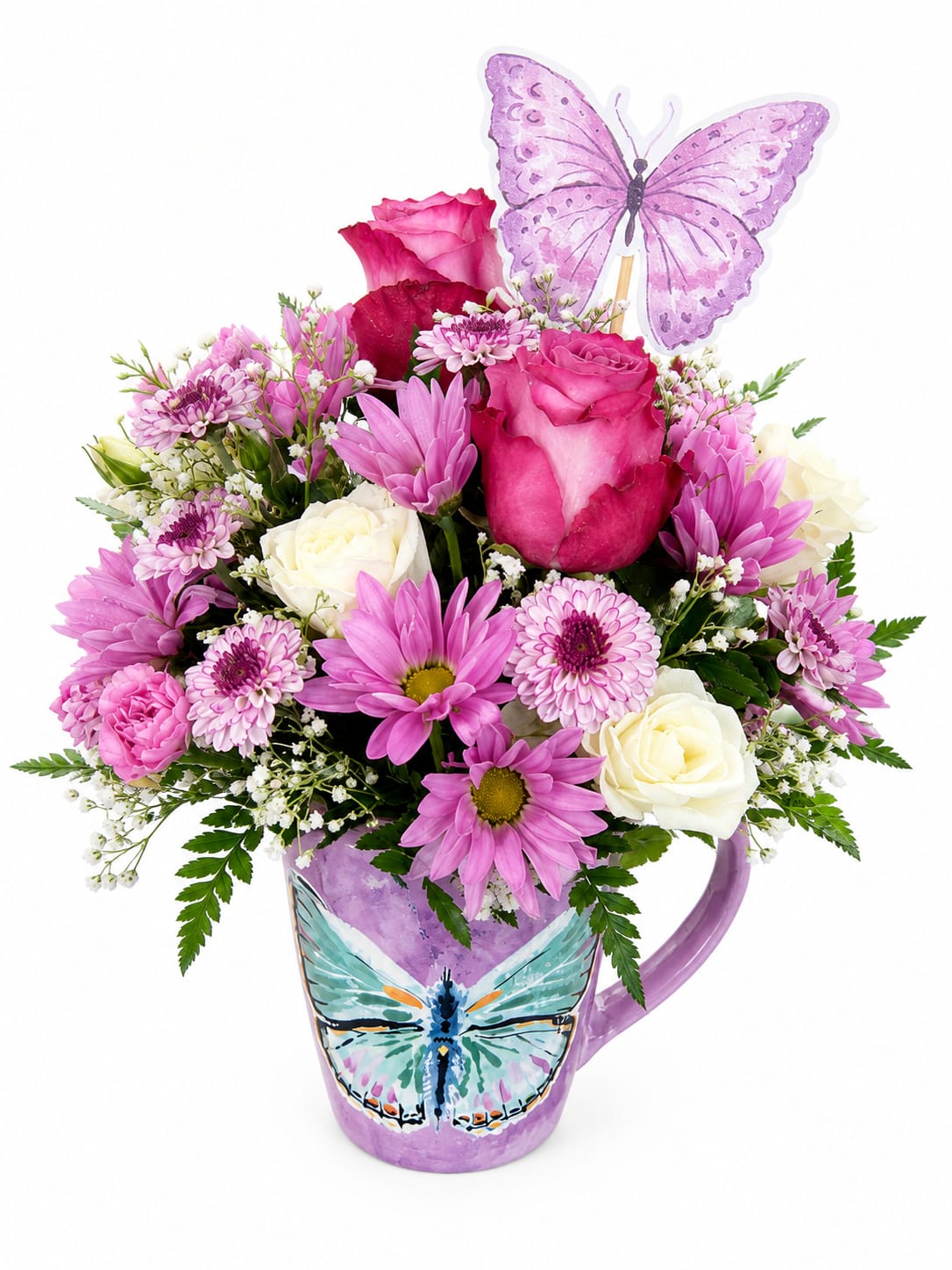 Butterfly Garden Mug - Delicate, charming, and full of beauty, the Butterfly Garden Mug is designed to brighten someone’s day. Arranged in a reusable butterfly-themed ceramic mug, this fresh floral design features a beautiful mix of roses, daisies, cushion mums, and seasonal accents, finished with a whimsical butterfly pick.   Mug color may vary. 