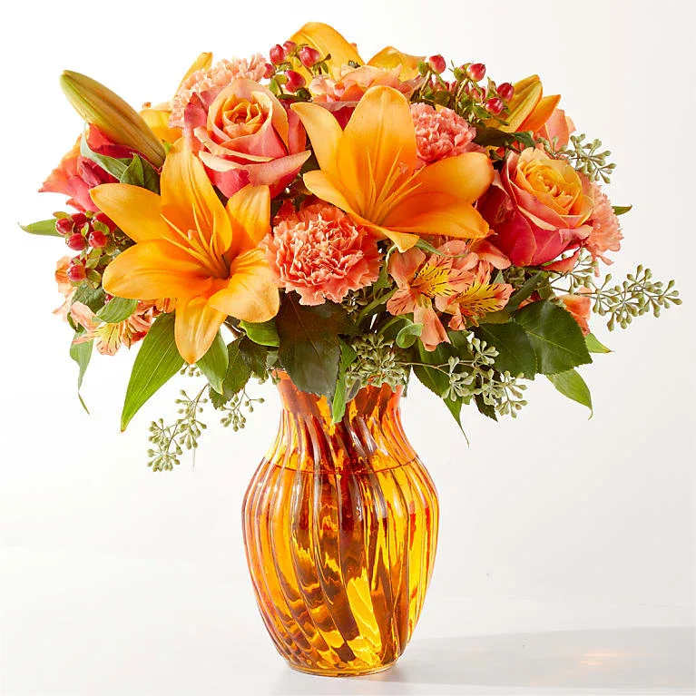 Afternoon Light Bouquet - Radiating light and warmth like the afternoon sun through a bay window, this fusion of varying shades of orange will bring a moment of peace to their day.
