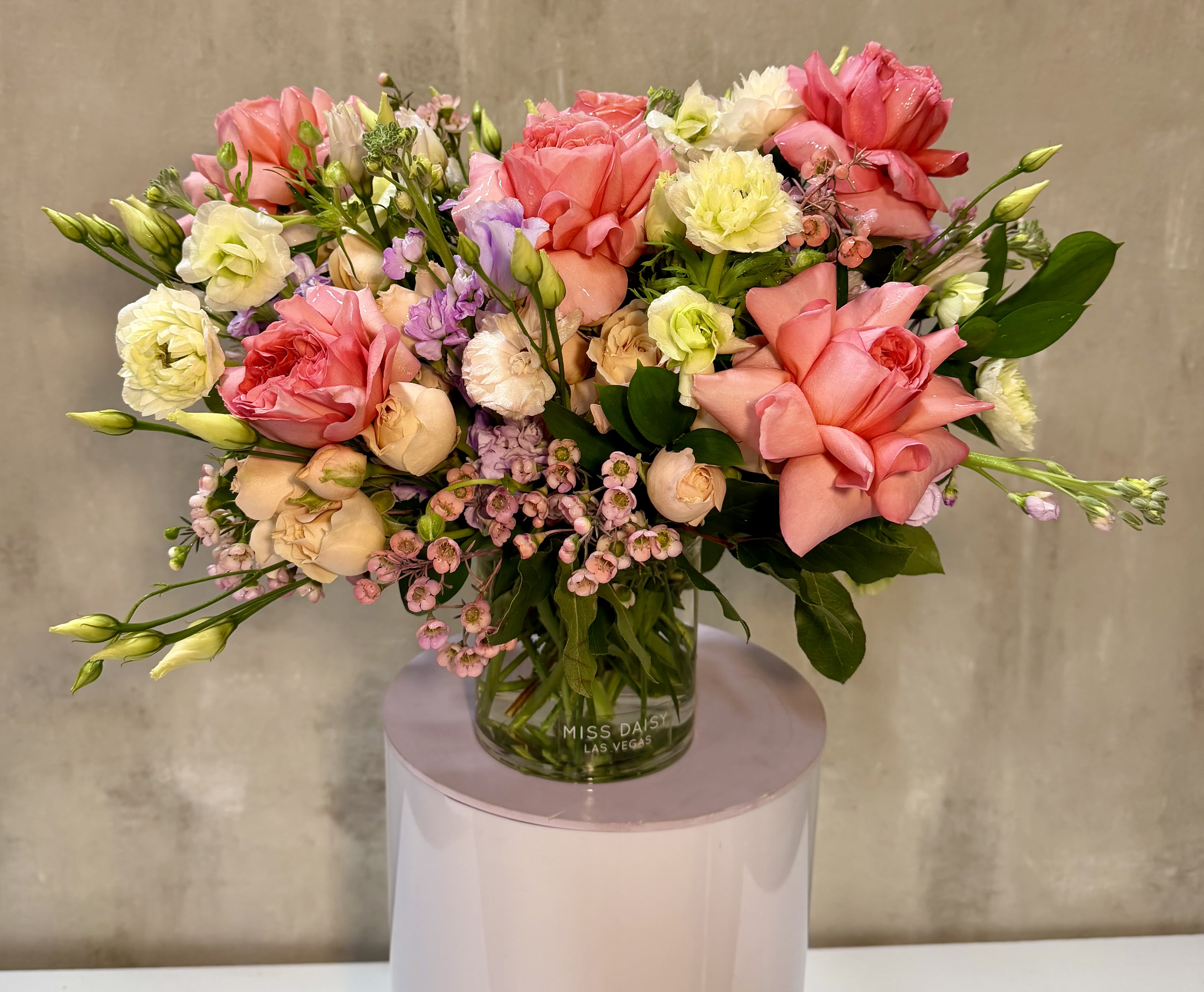 Mixed pink and cream bouquet in a glass vase