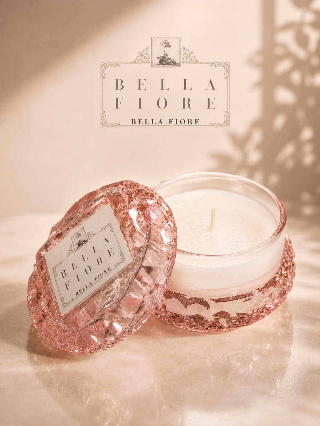 Pink glass candle jar with a white candle and matching lid