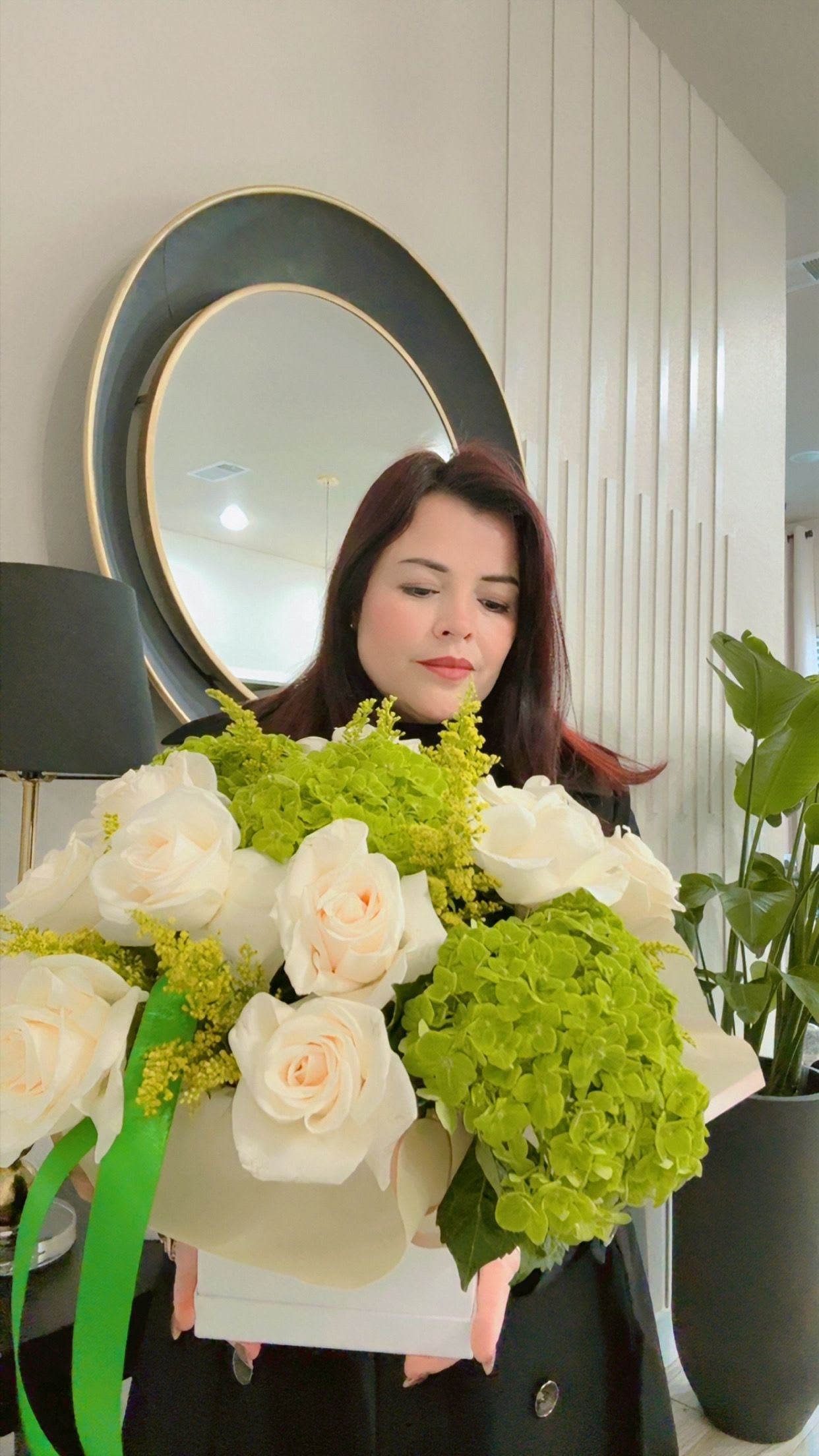 White roses and green hydrangeas in a box bouquet