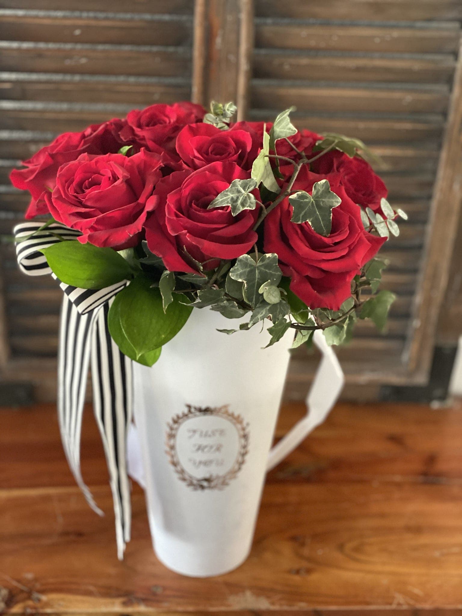 Bucket of Love  - A 15” white or black bucket with 8 red roses to demonstrate your love. 