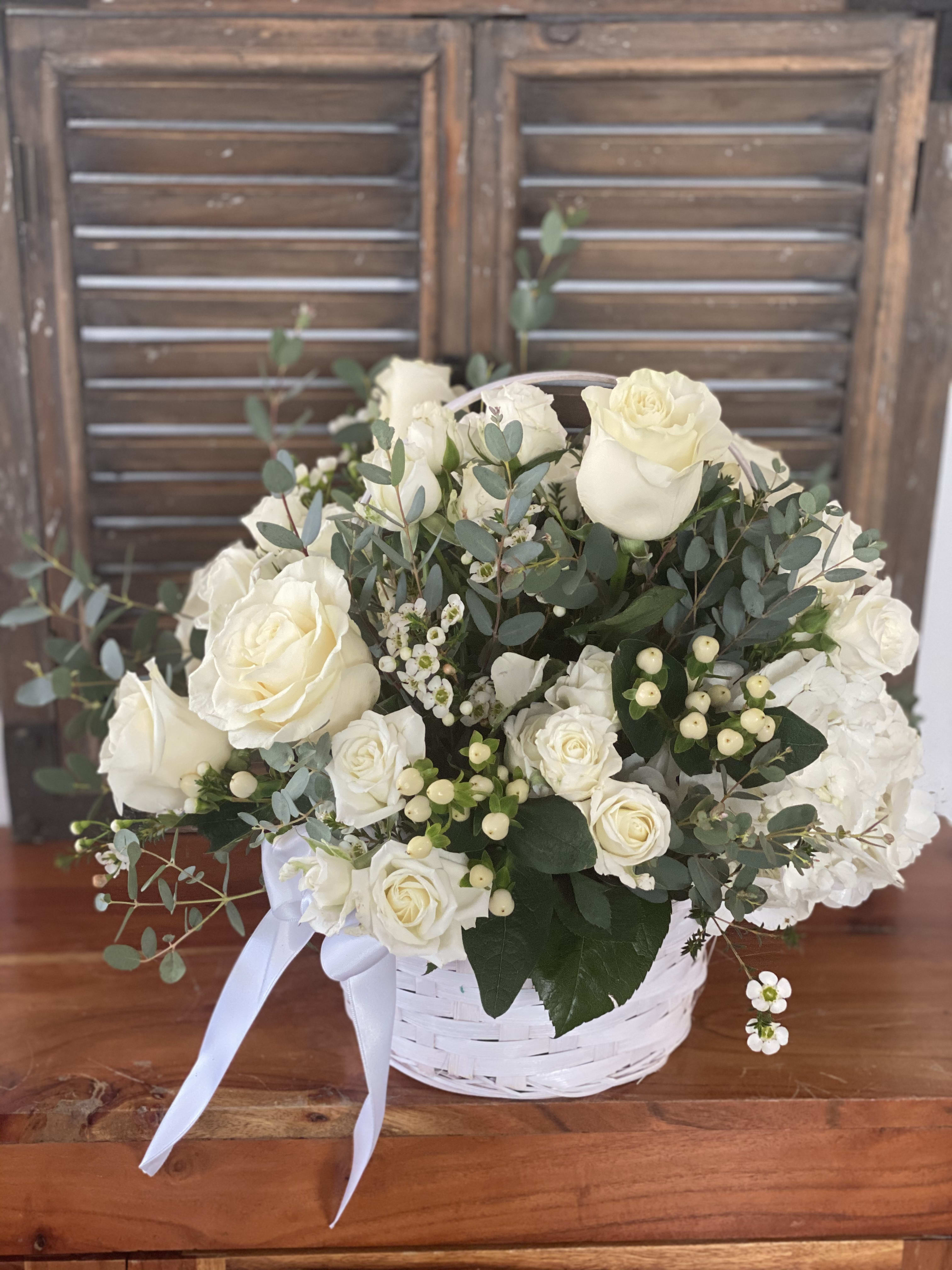 Missing you  - White basket with fresh white roses perfect bouquet to express your love.